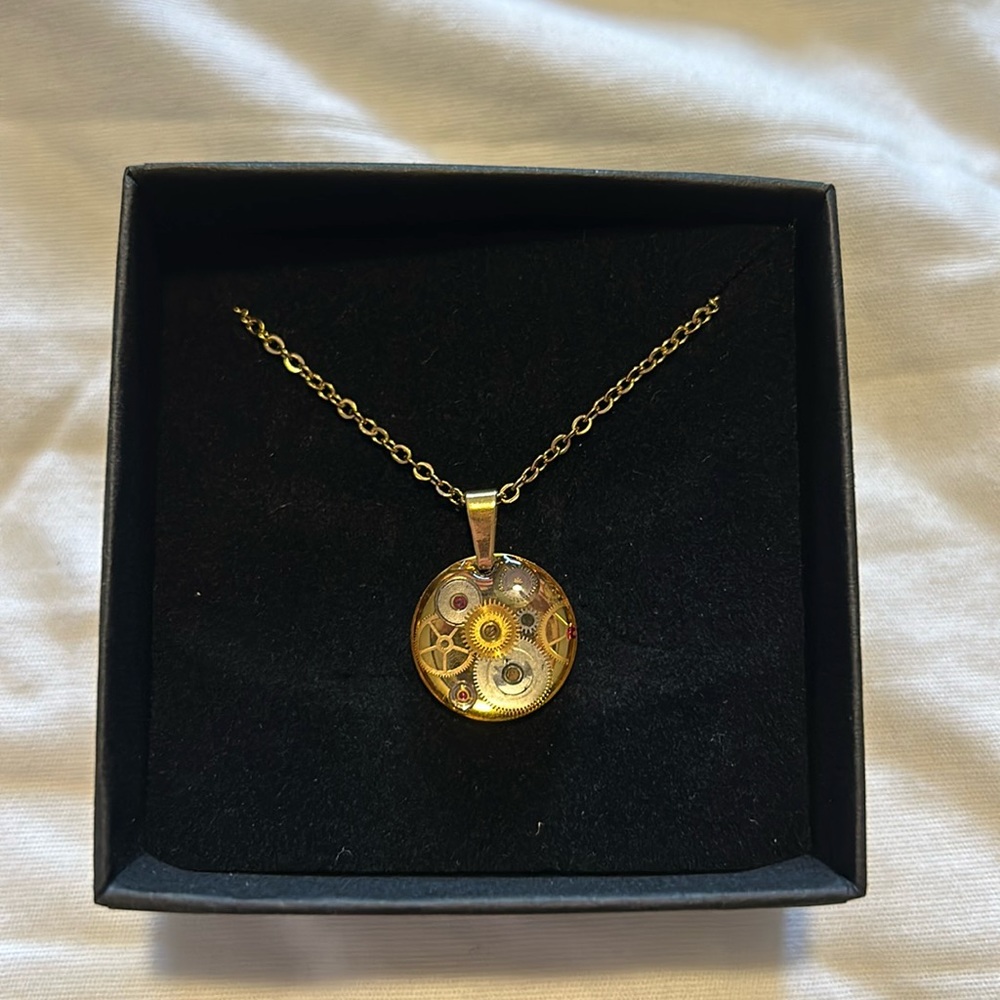 Unique clock necklace 24 carot gold chain.